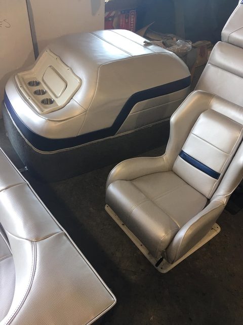 Boat seats and a console in silver vinyl with navy trim